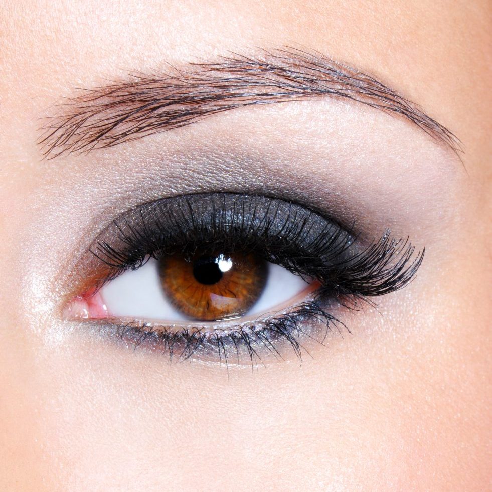 Female eye with dark brown glamour make-up - macro shot